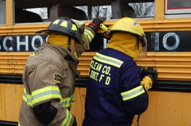 Firefighters train near a schoolbus