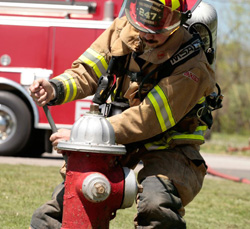 Fireman workin on Fire Hydrant